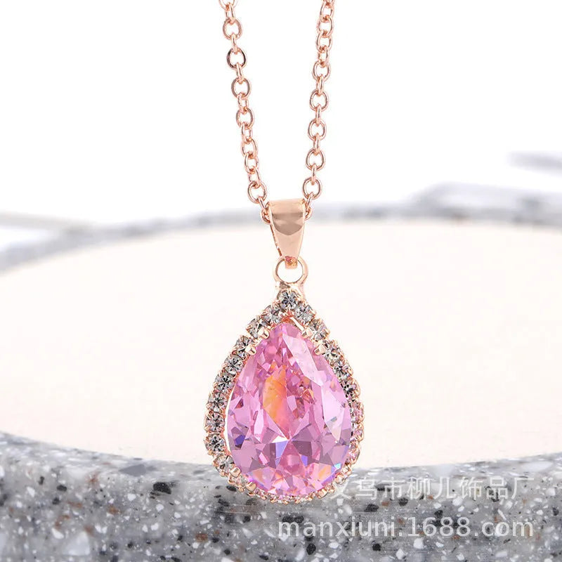 Pink water drop geometric necklace with rose gold electroplating and rhinestone detailing on alloy pendant