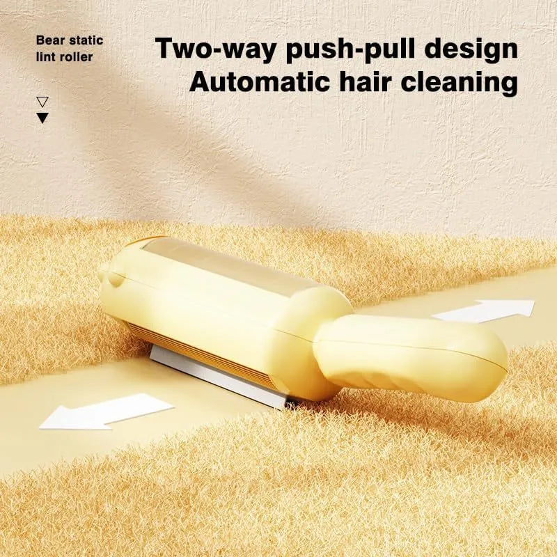 Blue reusable pet hair remover roller with self-cleaning base on a fabric sofa.
