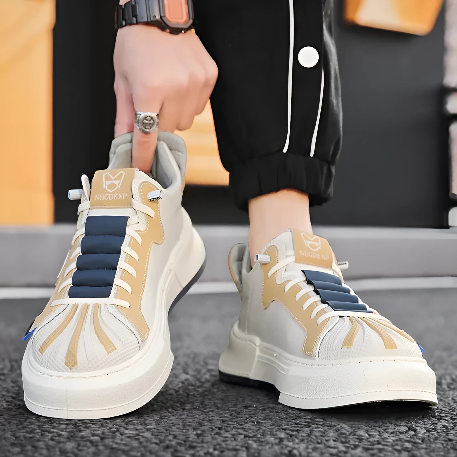 Men's beige low-top casual sneakers with elastic band closure and round toe.