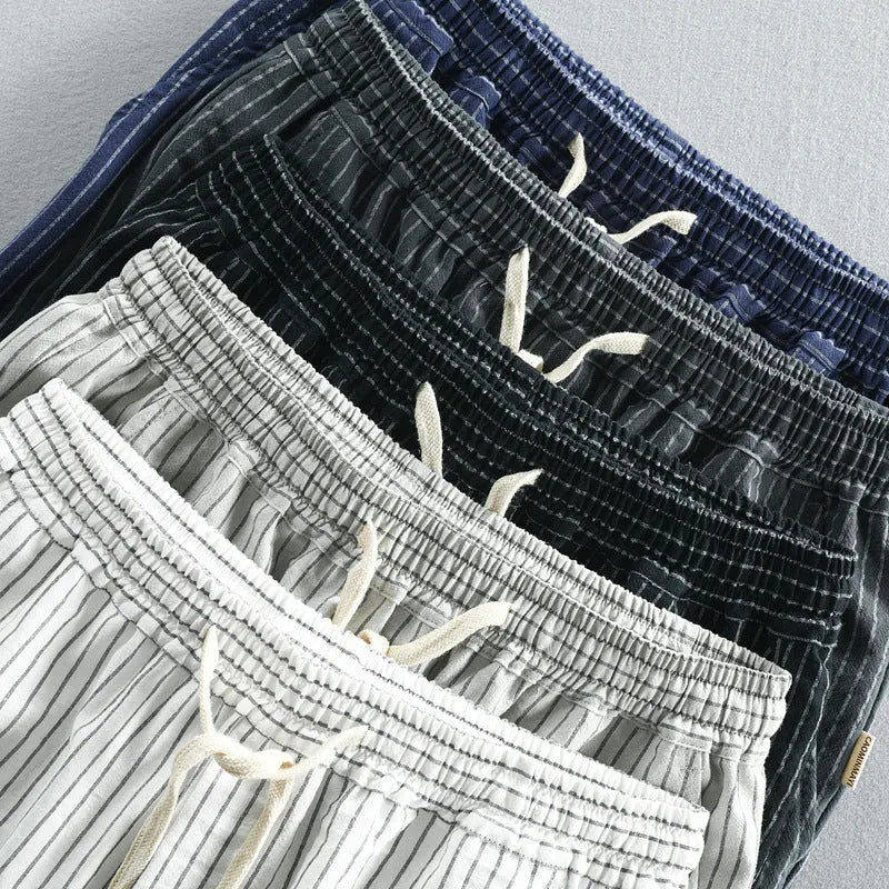 Men's striped casual shorts in cotton with elastic waistband shown in multiple colour options