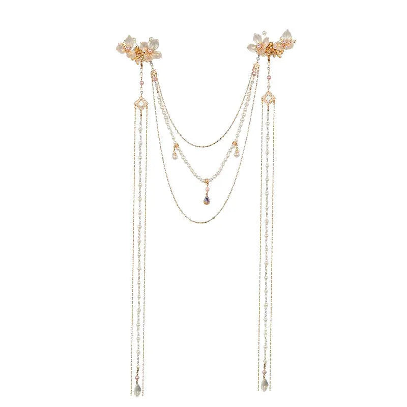 Gold-coloured women's acrylic hairpin with pearl, diamond and long tassel decoration.