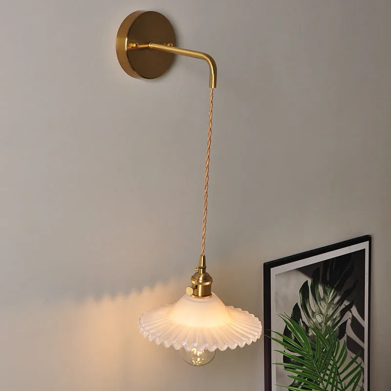 Copper retro lotus wall lamp with glass shade in amber colour variation