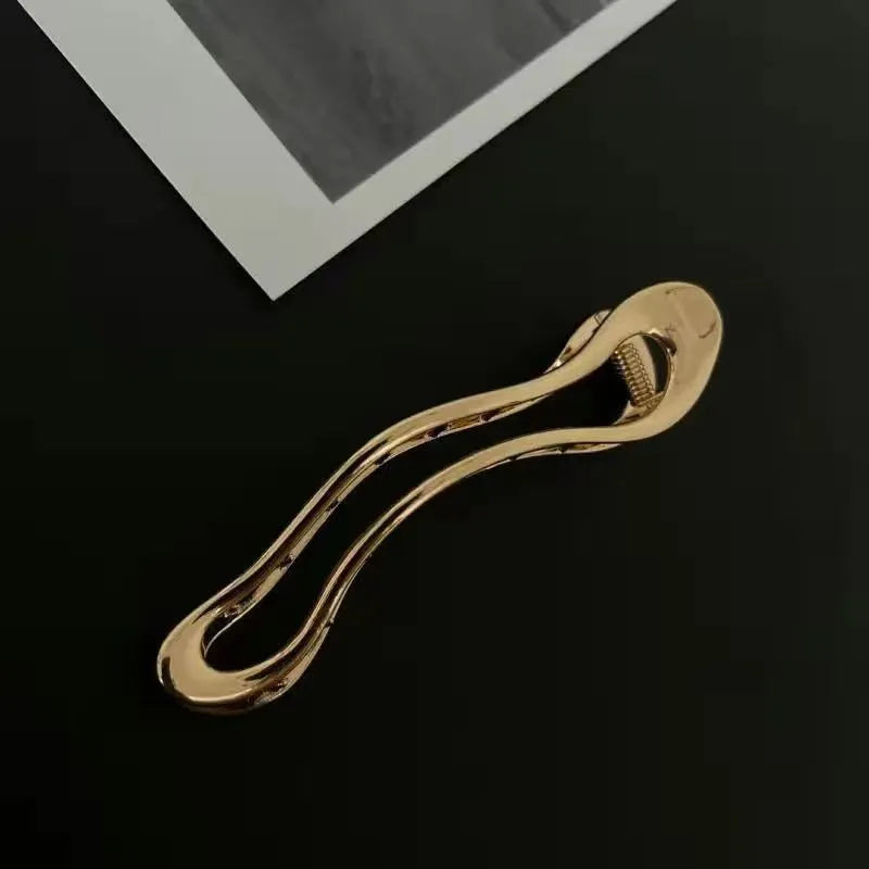 Women's zinc alloy hair barrettes in gold and silver with square, arc and triangle shapes