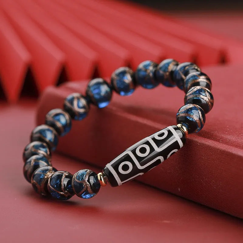 Chinese-style coloured glaze bracelet with five-colour design and Year of the Snake lucky beads.