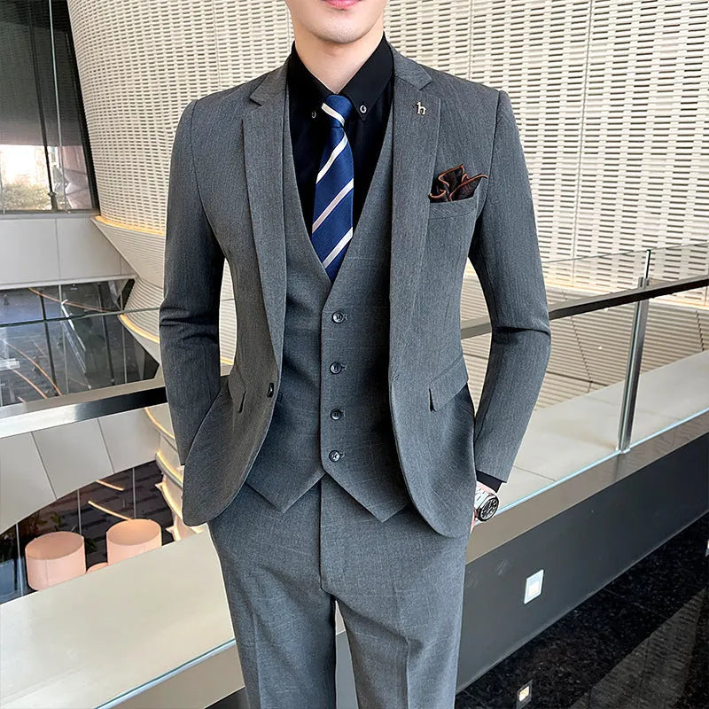 Men's slim fit British style business suit in black or dark grey with adhesive interlining construction