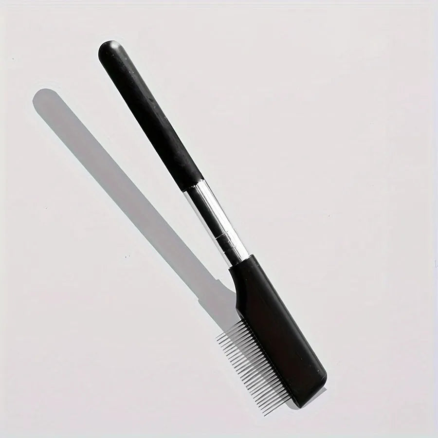 Black dual-sided pet grooming brush with soft bristles for eye area and comb for hair removal
