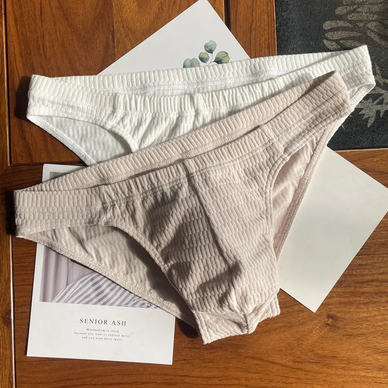 Men's solid colour cotton triangle underwear briefs with mid waistband, shown in apricot black colour.