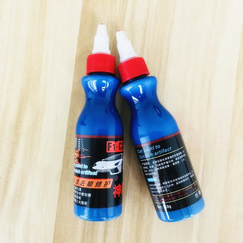 Small blue bottle of 30ml car scratch repair agent with applicator brush for automotive paint touch-ups
