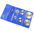 Set of six small circular high-speed steel saw blades and a mandrel on a white background