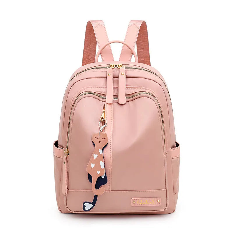 Women's black nylon backpack with waterproof lining and multiple zippered compartments