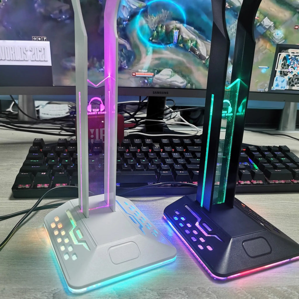 RGB colour changing headphone display stand with dual USB ports on a desk