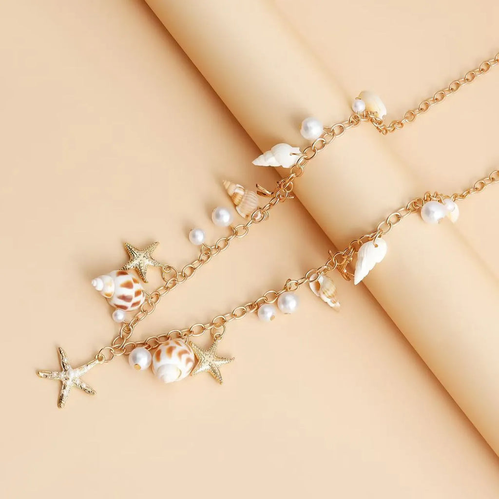 Women's alloy waist chain and matching bracelet set with star-shaped charms for summer wear.