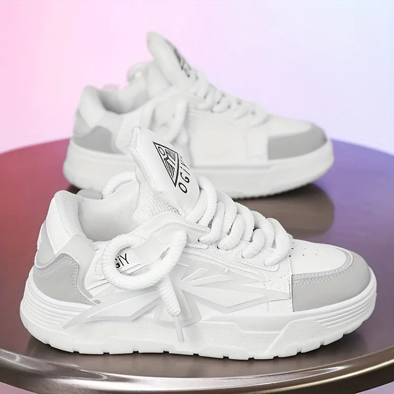 Men's white chunky sneakers with a cartoon totem pattern on the synthetic leather upper and a thick rubber sole.