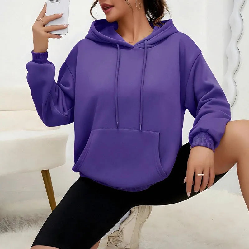 Loose fit women's sweatshirt with drawstring and pocket detail in various colour options