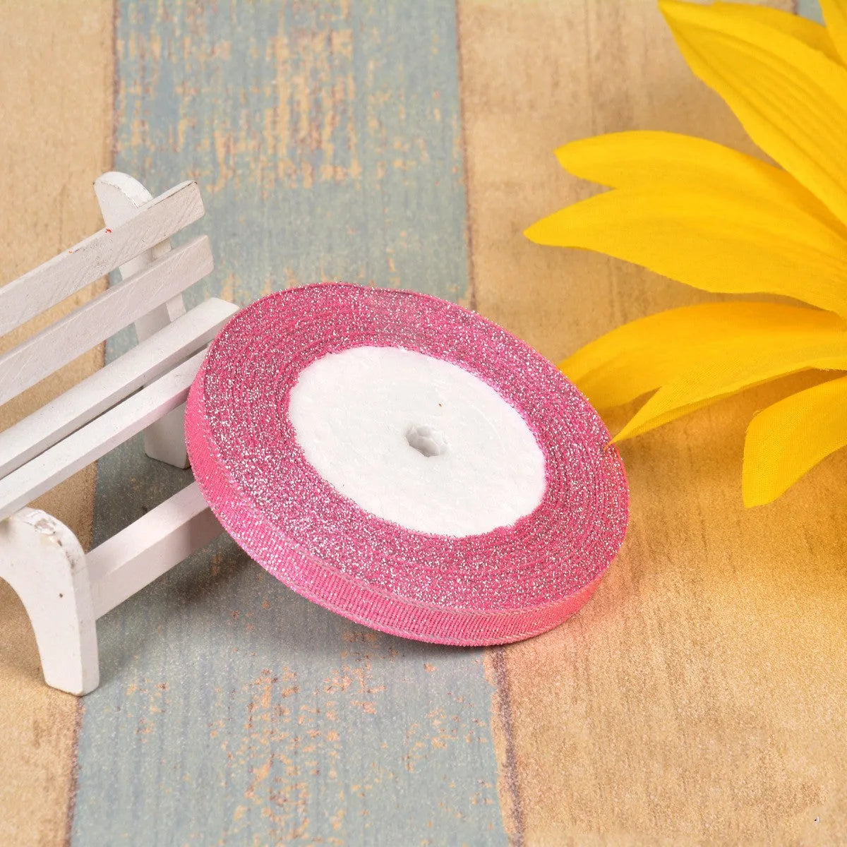 Polyester ribbon spool in metallic colours for decorative clothing and gift packaging trim