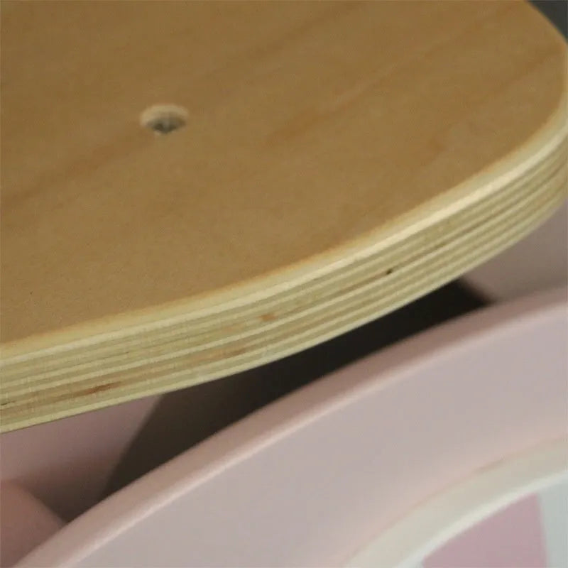 Pink wooden balance scooter for toddlers and children aged 1 to 6 years.