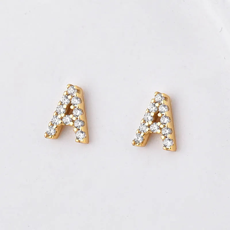 Gold plated English alphabet letter earrings with zircon stone accents on copper base