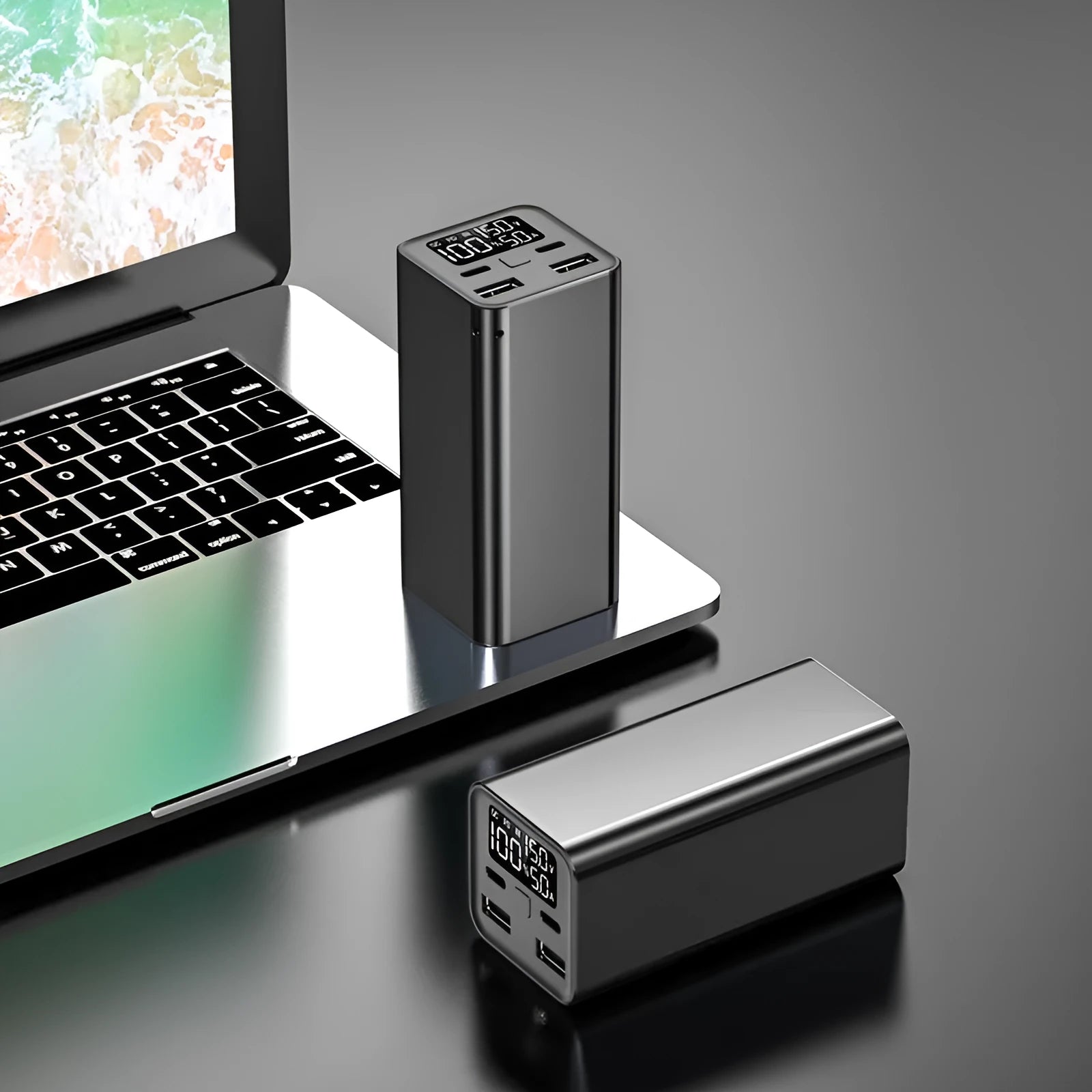 Black high power 65W metal laptop charging bank showing size and ports.