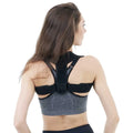 Black adjustable breathable posture correction strap laid flat.