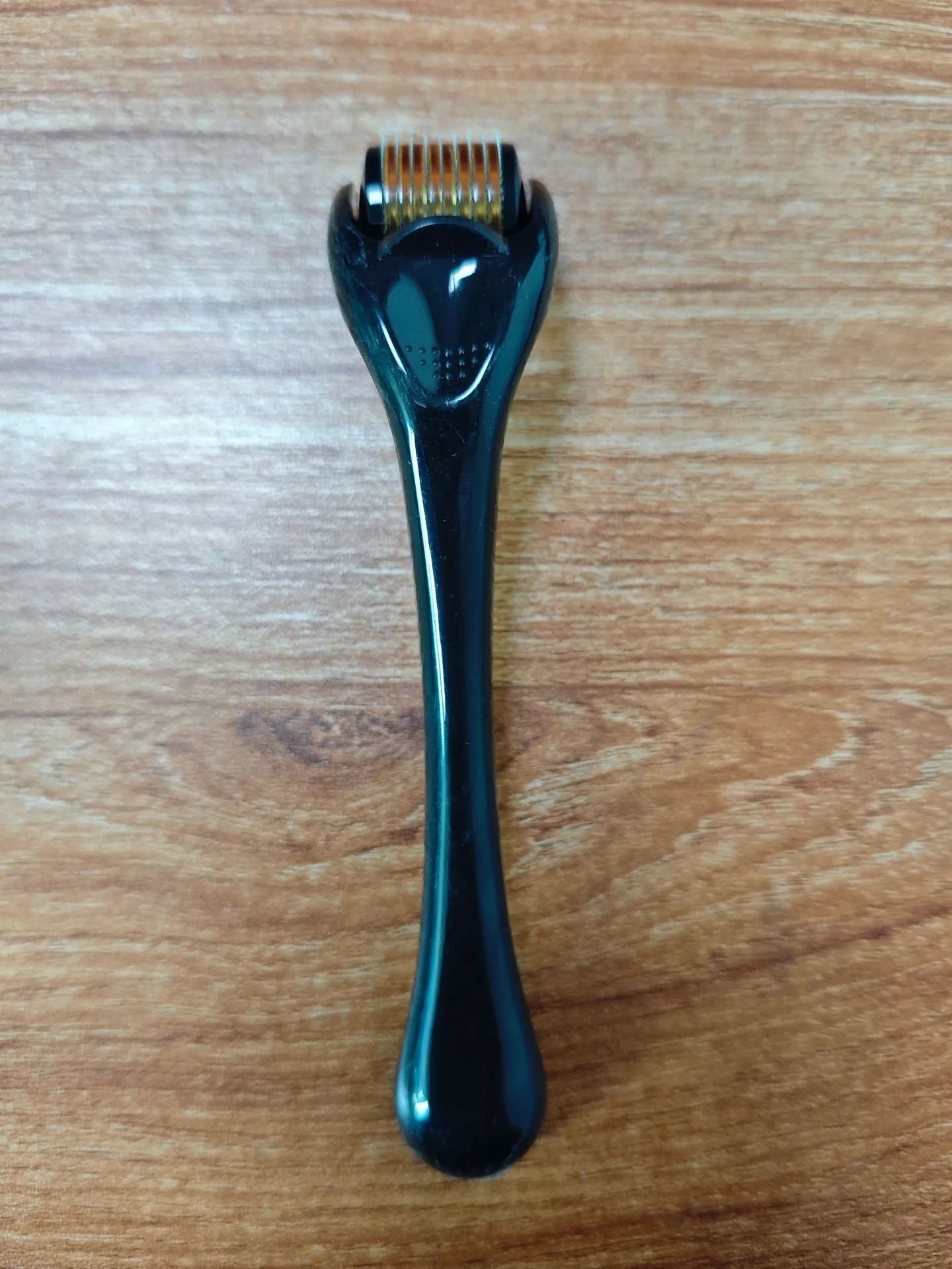 540 micro needle dermaroller roller with black handle and coloured wheel showing needle specification
