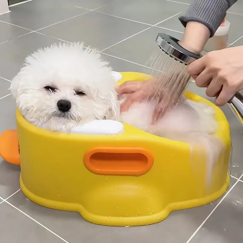 Blue PVC duck-shaped bathtub for washing a dog or cat at home