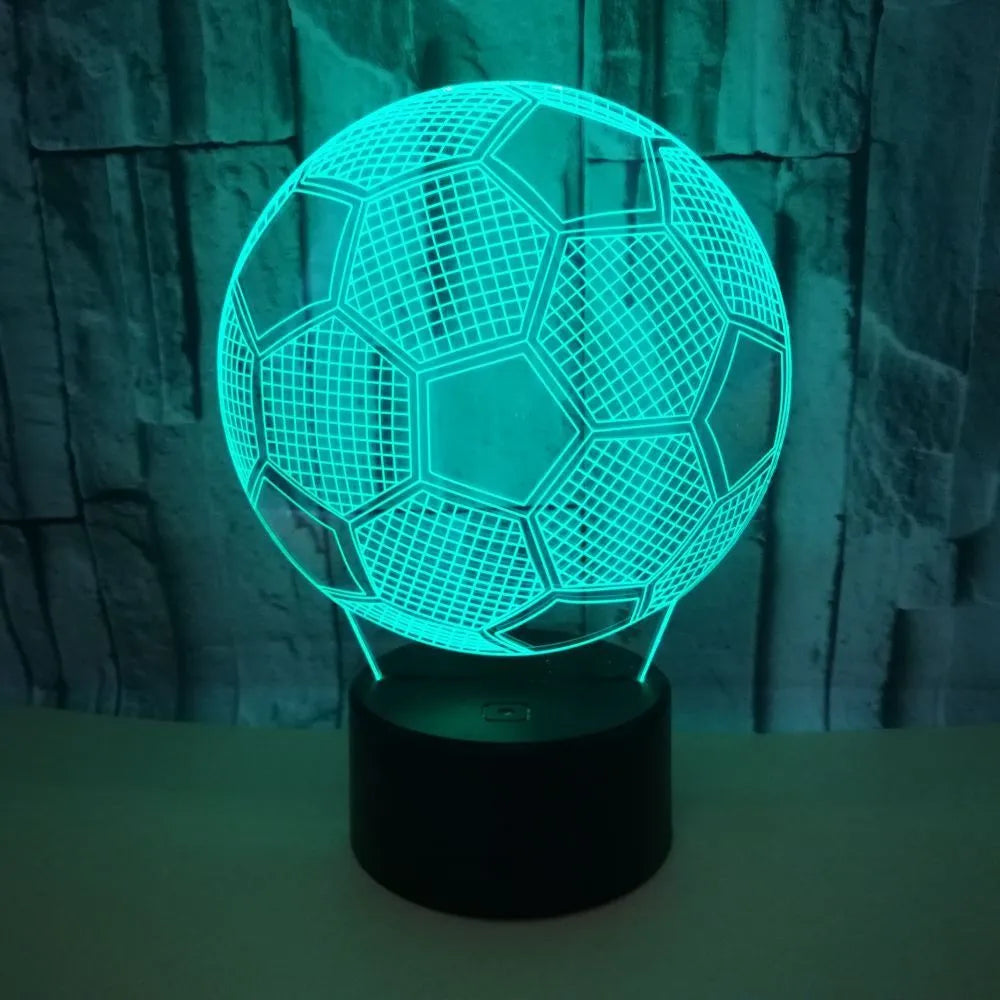 3D acrylic football night light showing red LED colour, with USB cable and remote control.