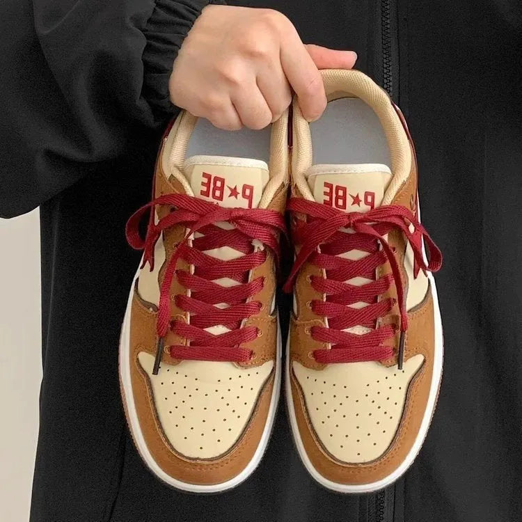 Brown women's platform sneakers with Pu leather upper, sequin details, and a lace-up front on a rubber sole.