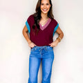 Burgundy women's loose sweater with contrast trim, V-neck and cuffed short sleeves