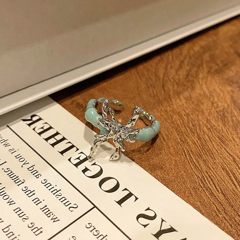 Copper women's ring featuring a creative Chinese butterfly design, available in multiple colours.