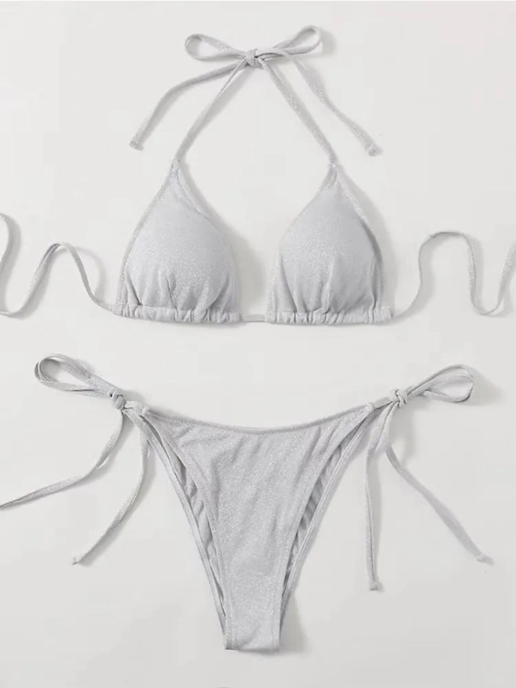 Female model wearing a khaki gold split bandage bikini, showing the briefs style and polyester construction.