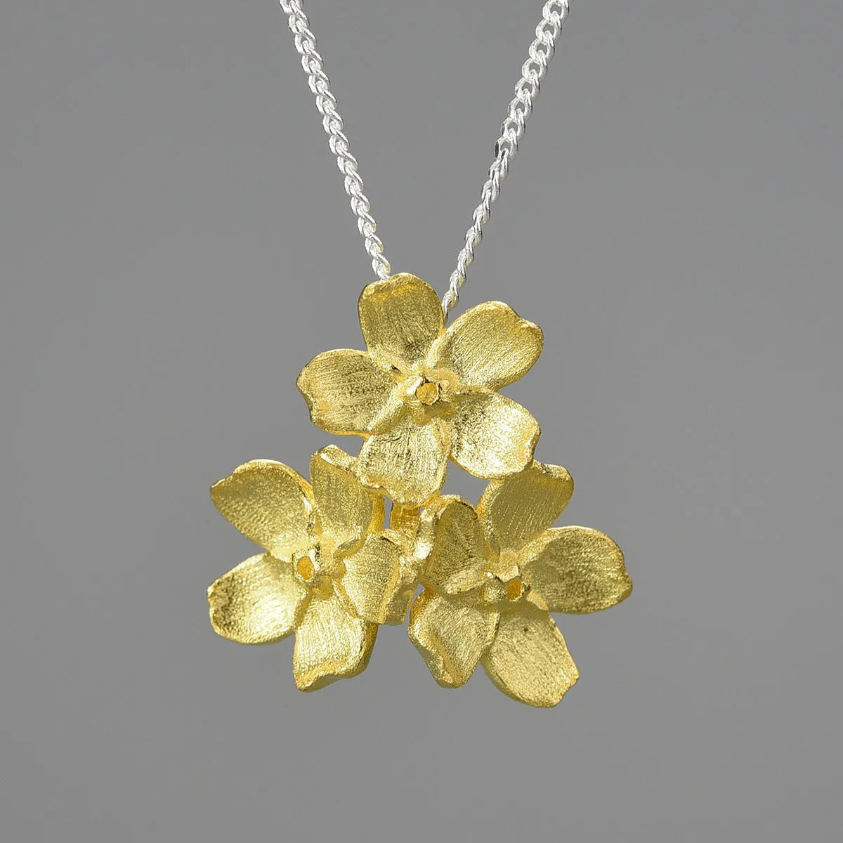 Myosotis Sylvatica forget-me-not flower sterling silver pendant with open mouth pastoral design