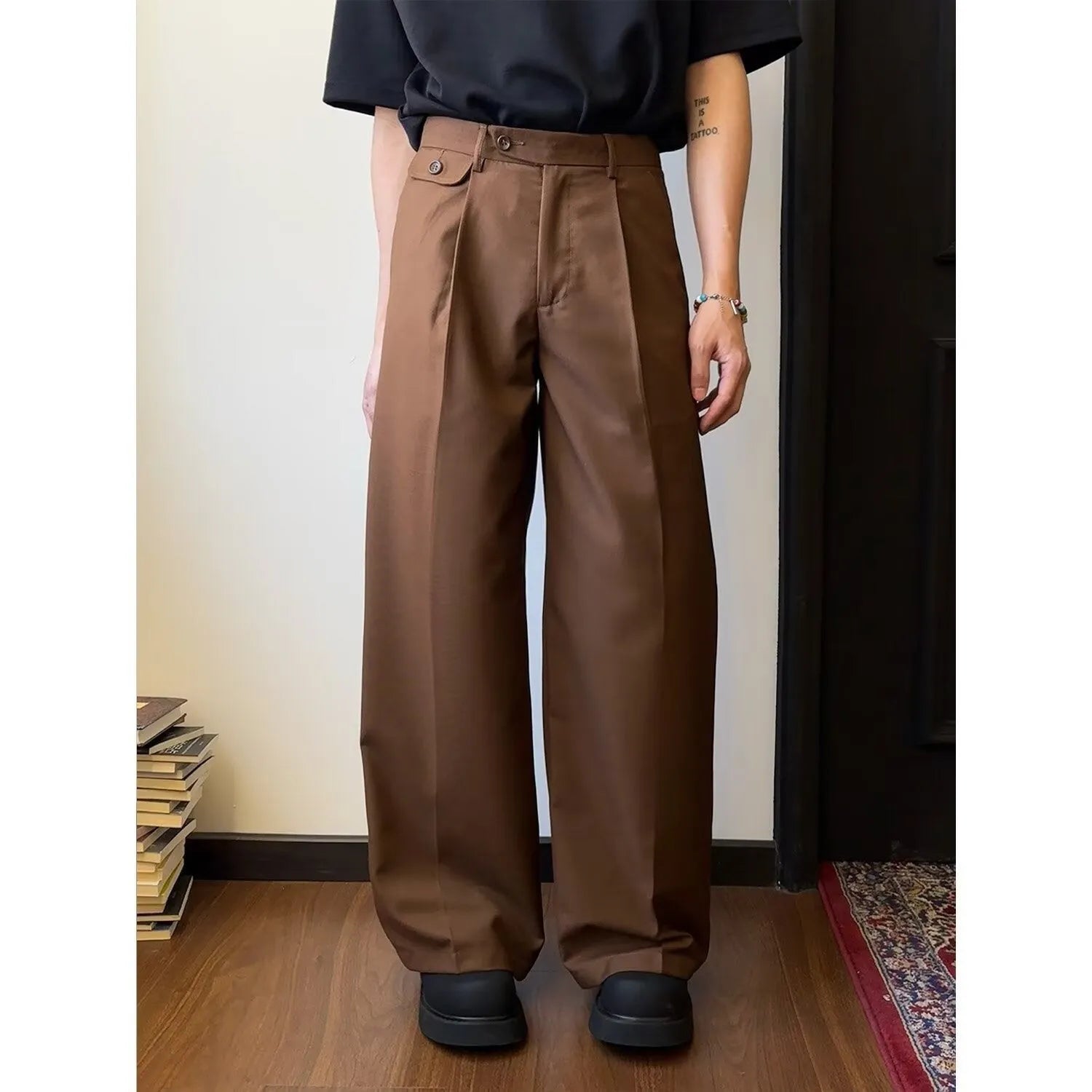 Men's straight-leg casual trousers in polyester blend fabric showing drape and wider cut design