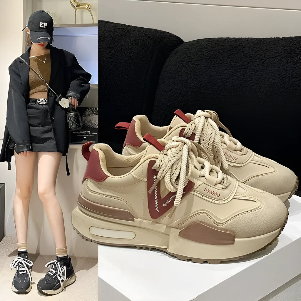 Women's black retro platform sports shoes with round toe and lace-up design on a white background.
