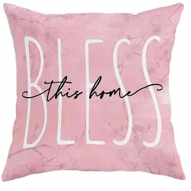 Short velvet square cushion cover with cherry blossom letter print, shown in one of four colour options.