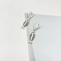 Women's fishbone pendant alloy necklace and matching earrings set on a white background