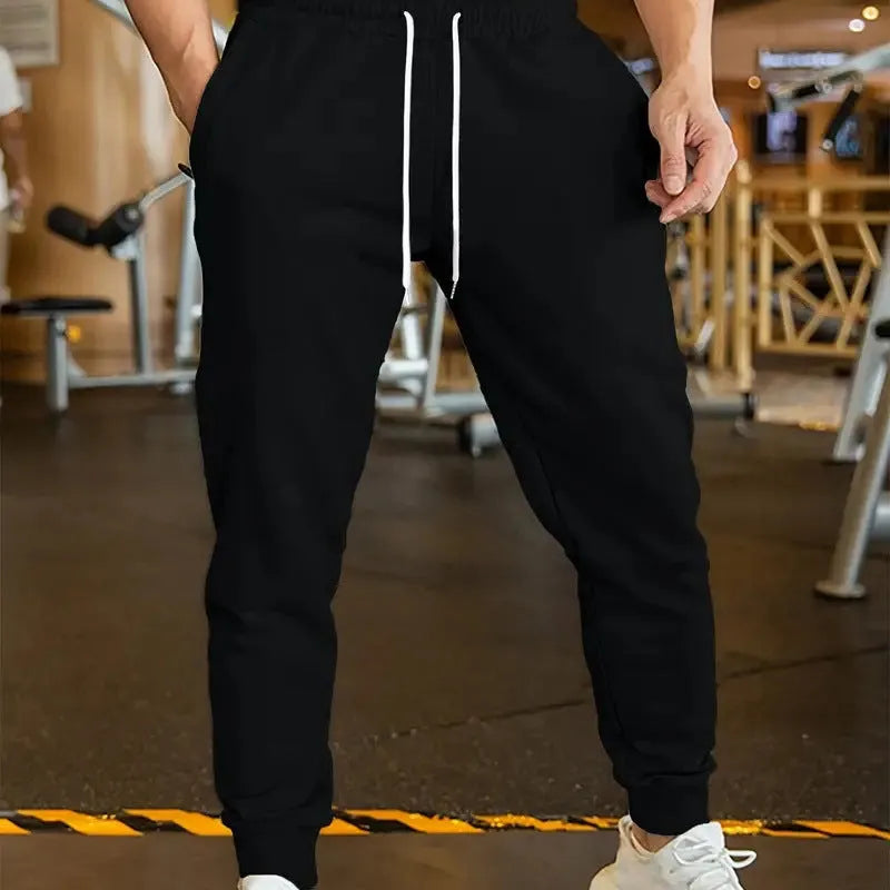 Men's loose-fit linen style leisure trousers with an elastic drawstring waist.