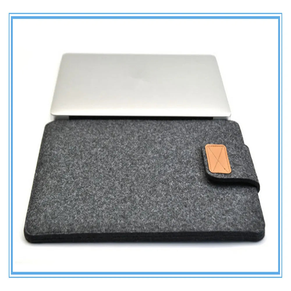 Frosted woven laptop bag with plush felt interior shown open to reveal corner protectors and organised storage