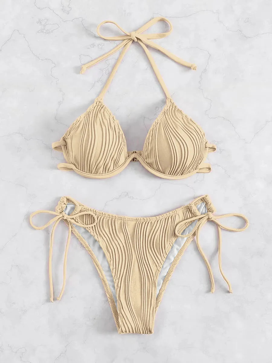 Women's apricot coloured underwire bikini swimsuit with adjustable side-tie bottoms on a mannequin.