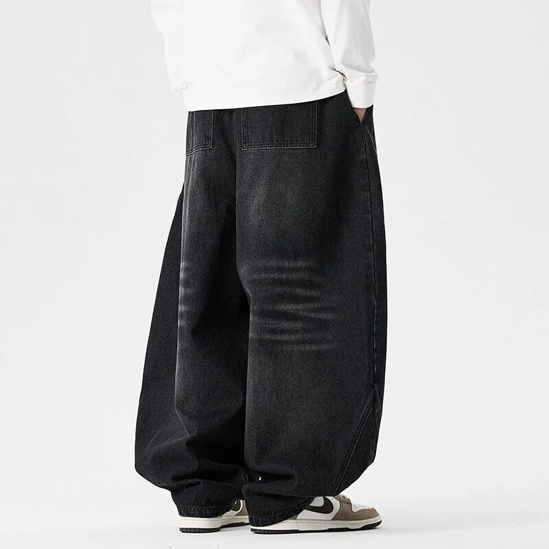 Men's plus size wide leg baggy jeans in black denim with straight leg openings
