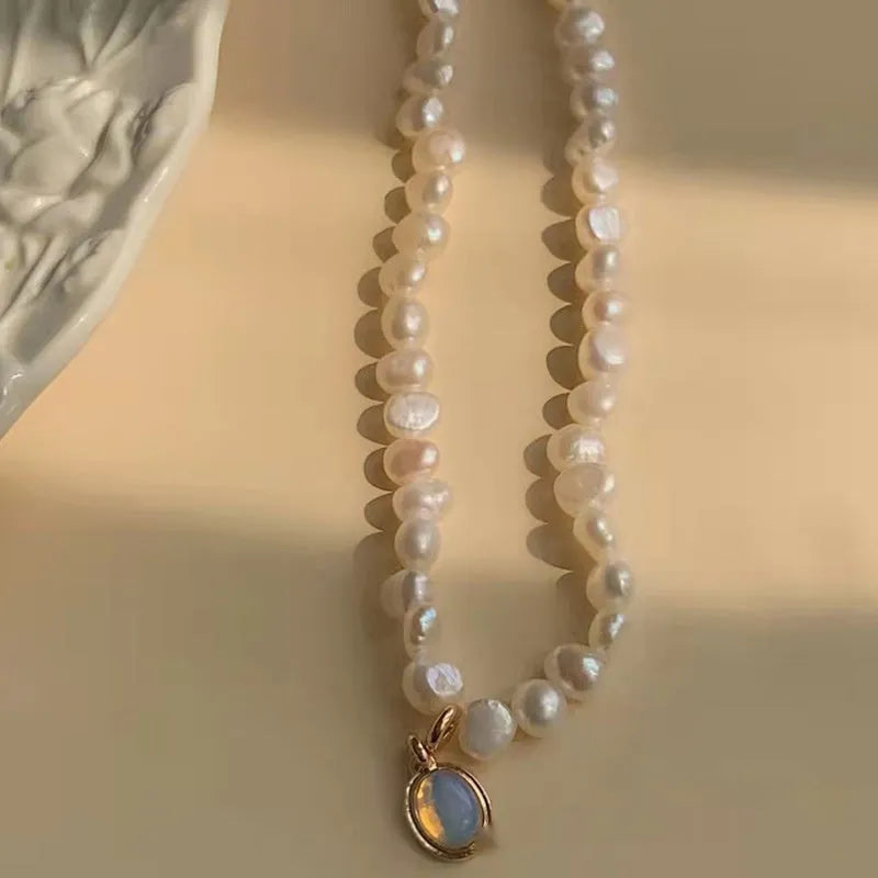 Adjustable French Court vintage style alloy necklace with geometric pendant and pearl details.