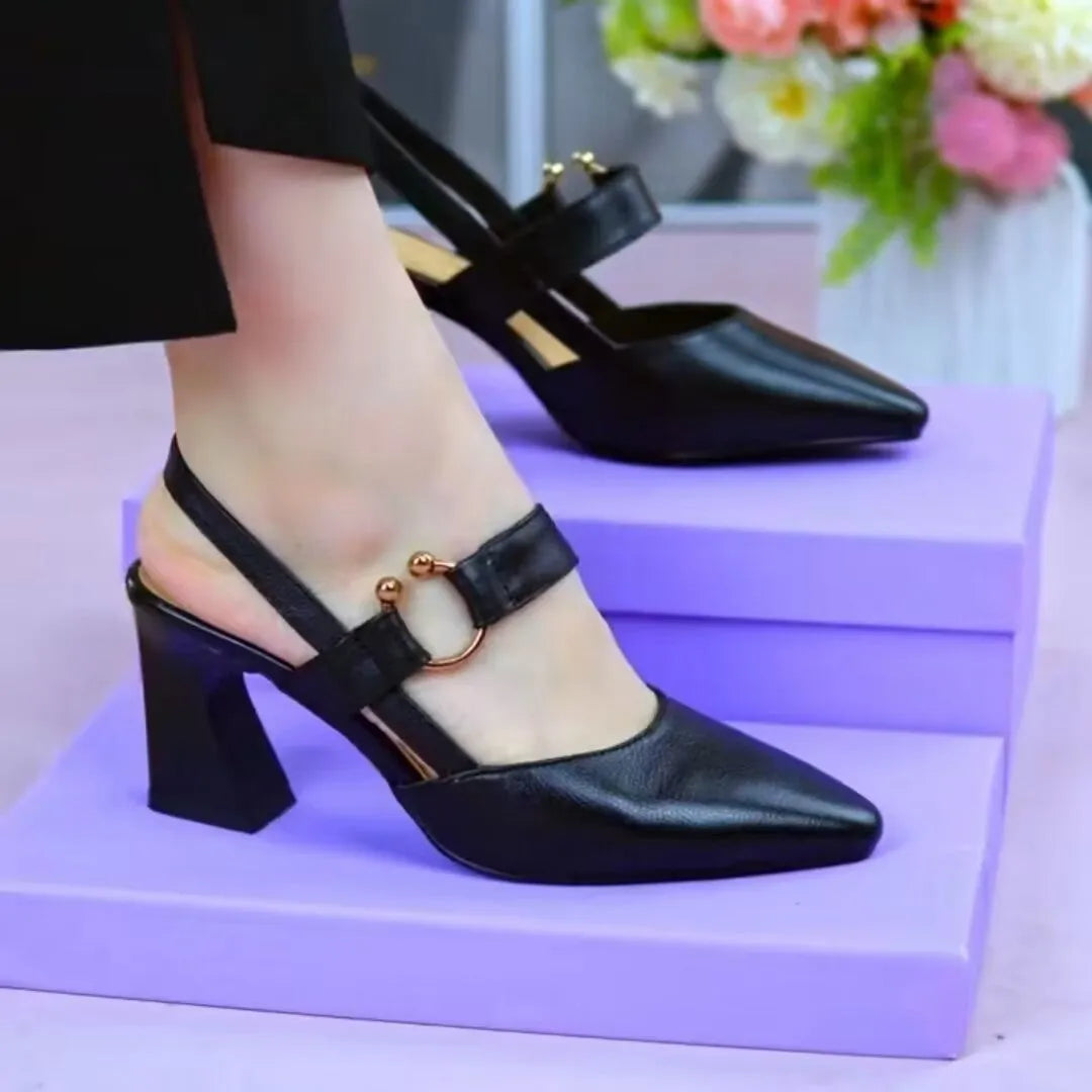 Women's apricot closed toe backless leather sandals with a chunky heel on a rubber sole.