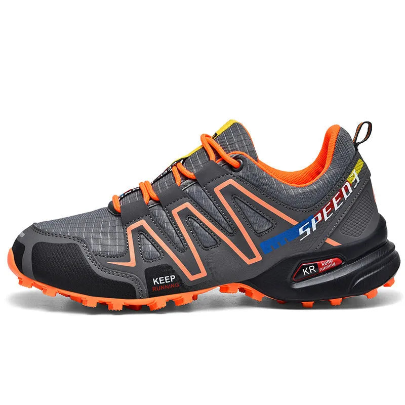 Men's low-top casual running shoe in synthetic leather with mesh lining, shown in grey orange colourway.