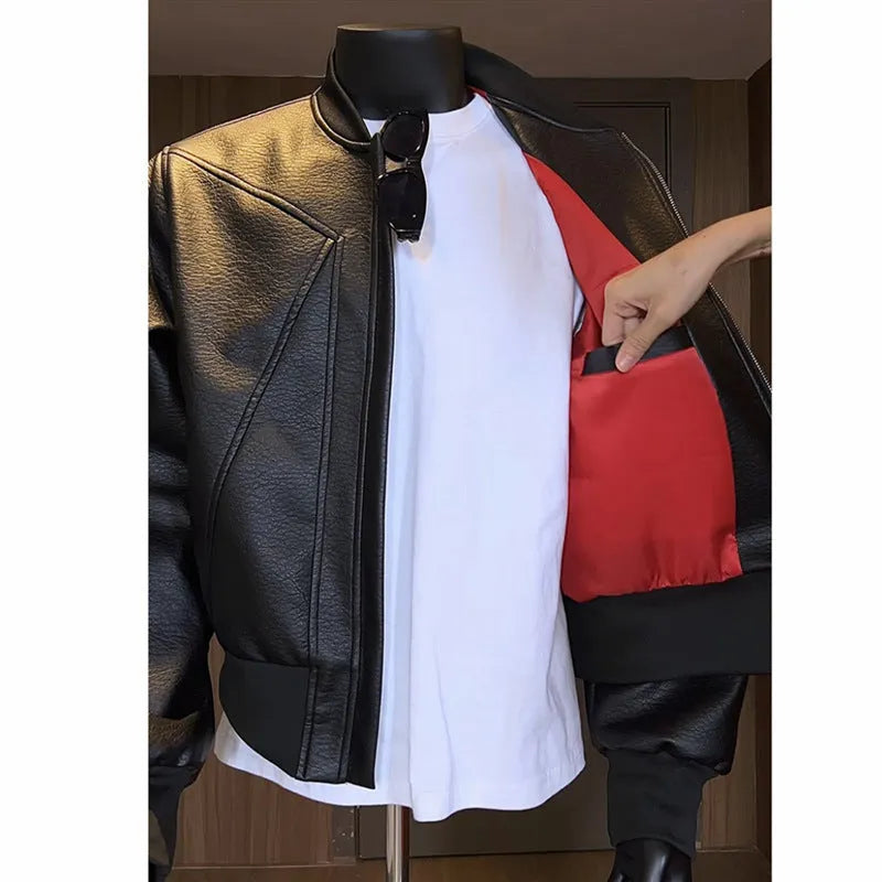 Men's black PU leather jacket with litchi grain texture, showing extended 100cm length and tight fit.
