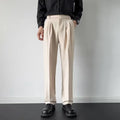 Men's straight cut loose fit suit trousers in apricot and black colours, made from polyester fabric.