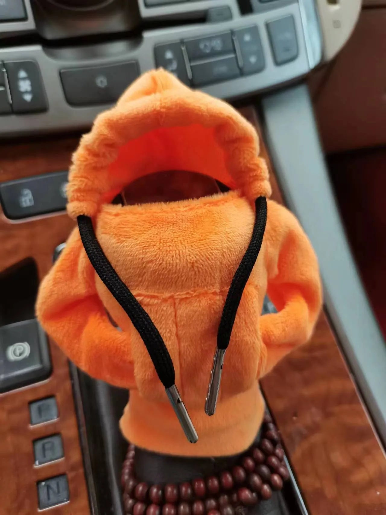 Soft Dutch velvet car gear handle cover in multiple colours on a gear stick.