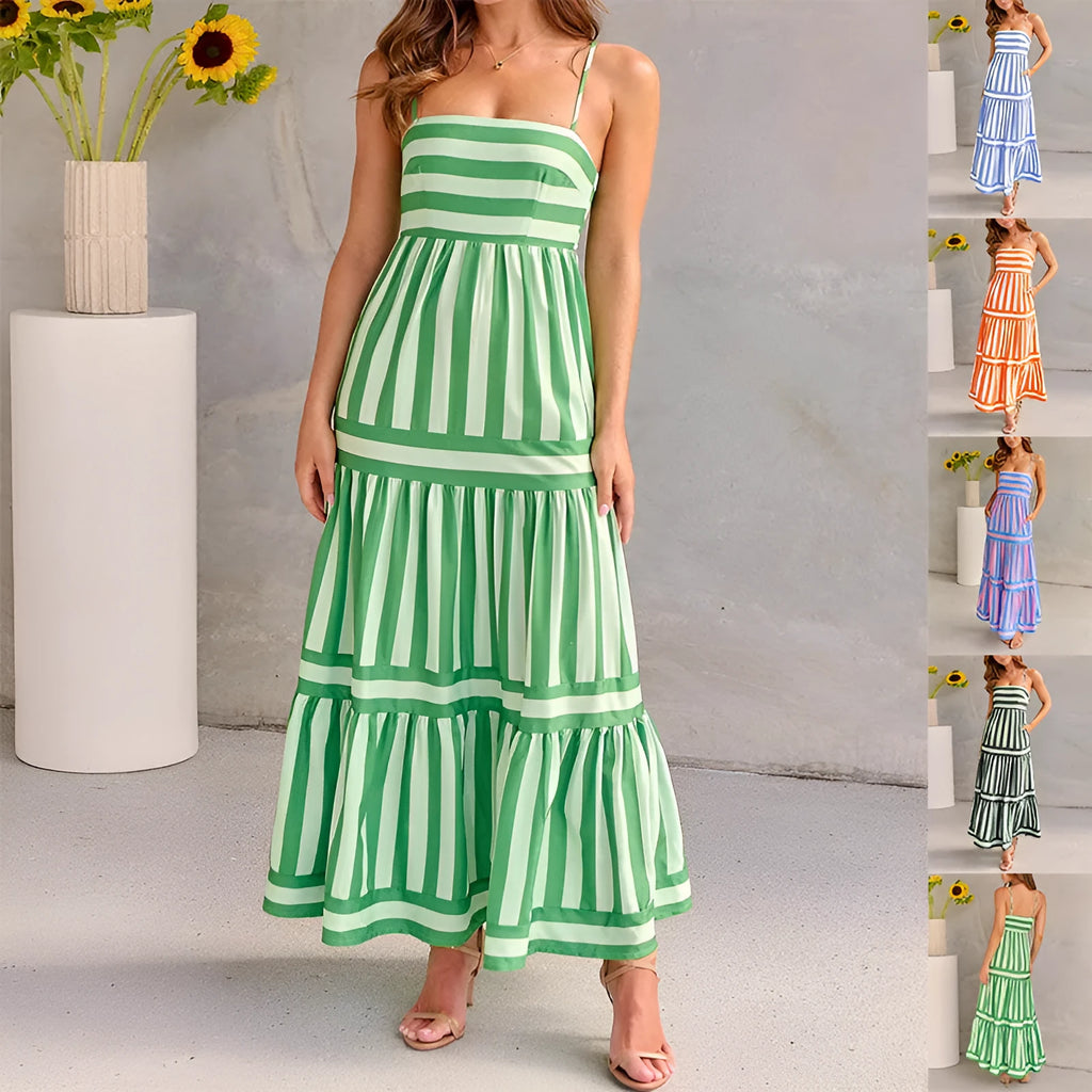 A woman wearing a striped backless suspender summer dress with a square neckline and side pockets.