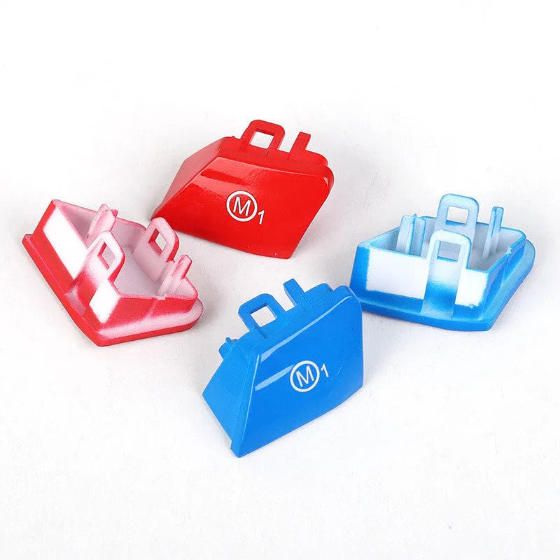 Pair of red and blue BMW steering wheel M1 and M2 mode replacement buttons on a white background.