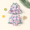 White children's two-piece swimsuit set with a top and matching shorts on a hanger.