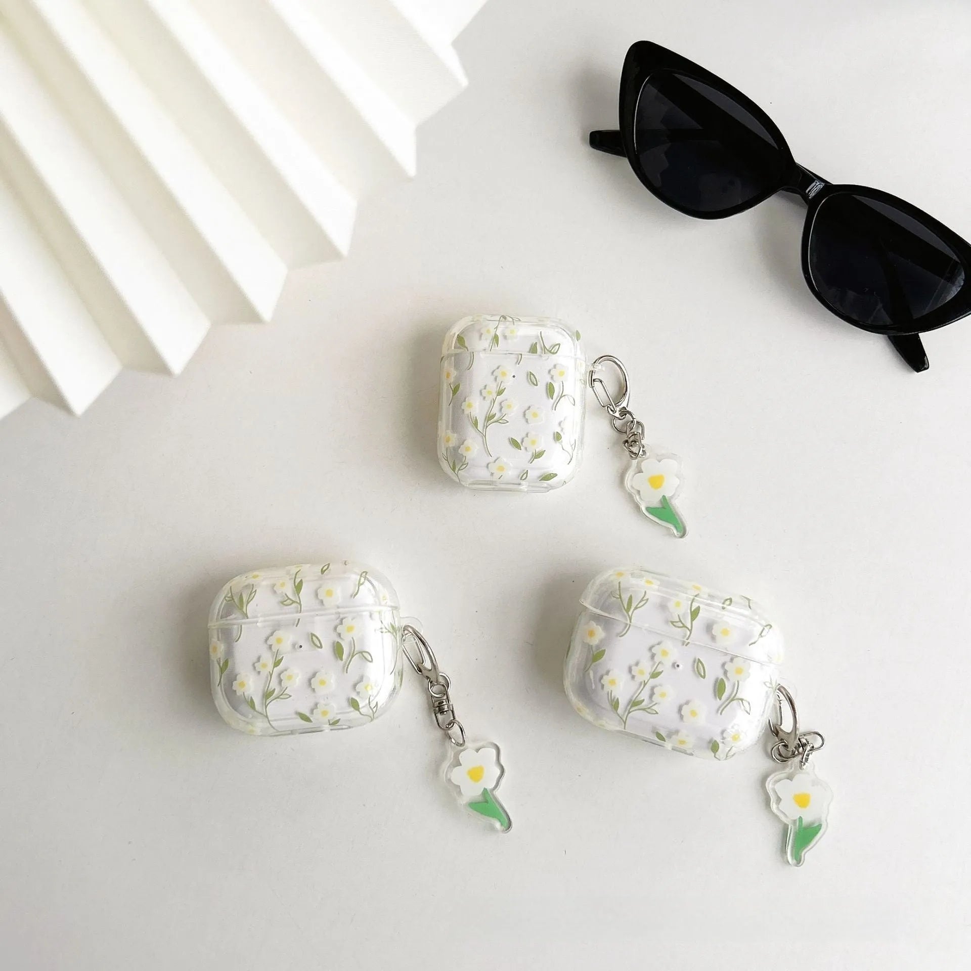 White floral pattern TPU protective case for Apple AirPods on transparent background