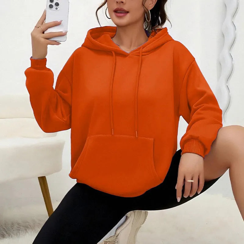 Loose fit women's sweatshirt with drawstring and pocket detail in various colour options